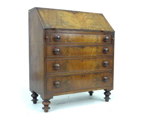 A Victorian mahogany bureau, fall front and fitted interior with five drawers with bone handles, above four drawers to its ba