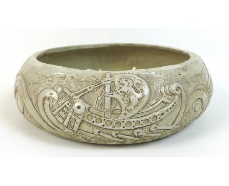 William Oram Trivett (British, 1872-1955), ceramic bowl, signed 'W.O. Trivett', with relief decorations of a trieme and a fri