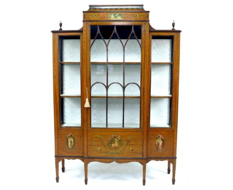 An Edwardian Sheraton style satinwood veneered breakfront display cabinet, the whole with painted decoration in Neoclassical 