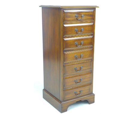 A reproduction George III style semainier, being a narrow chest of seven drawers, raised on bracket feet, 45 by 44 by 106.5cm