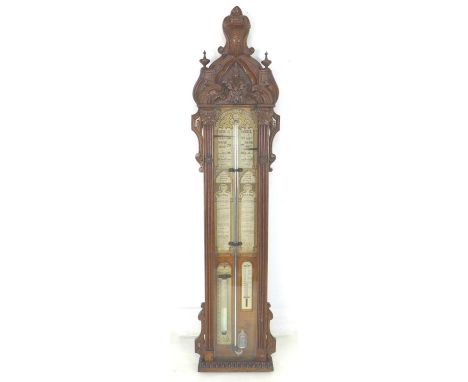 A Victorian Admiral Fitzroy stick barometer, in Gothic carved oak case, 30 by 9 by 125.5cm high 