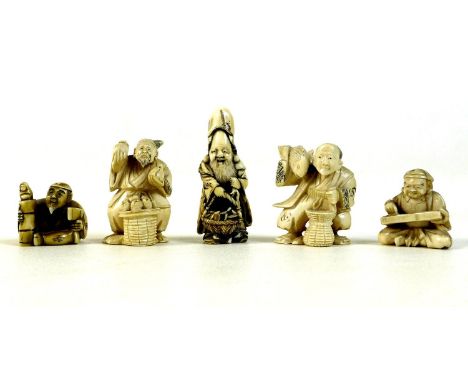 A group of five Japanese ivory katabori netsuke, late 19th and early 20th century, comprising a vendor standing holding a bas