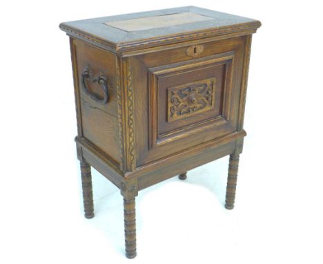 A 20th century oak chest on stand, the lift lid with elm inlay and large brass hinges opening to reveal a purple cloth lined 