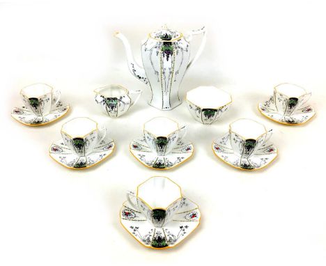 An Edwardian Shelley china part coffee service, decorated in the 'Bunch of Grapes' pattern, Queen Anne shape, comprising coff