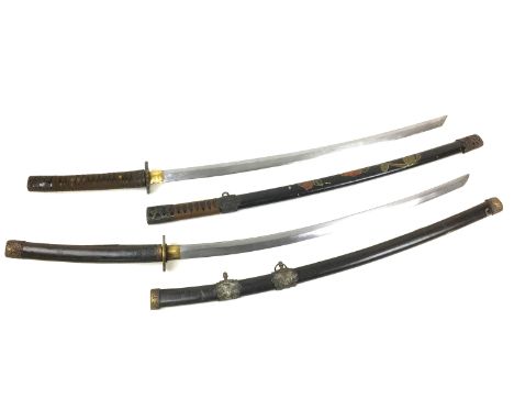 Two late 20th century reproduction katanas, one with a signed tsuba and a four character mark to its tang, 70cm long blade, 1