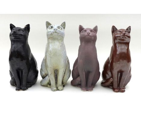 A group of North Shore pottery, comprising four ceramic cats two signed JMR on base, height of each 25.5cm. (4) 