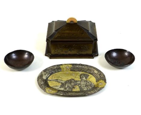 A group of Japanese metal items, comprising an early 20th century bronze cigarette box, of rectangular form with incuse corne