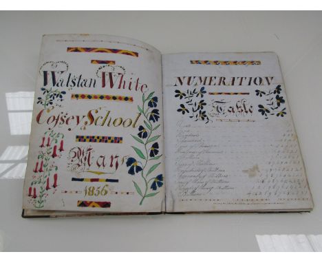 A 19th Century school child's excercise book, manuscript pen, ink and watercolour decorative title page "Walstan White - Coss