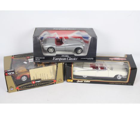 Ertl, Bburago, Maisto - Three boxed diecast 1:18 scale vehicles. Lot consists of a Limited Edition Bburago #3356 QVC Exclusiv