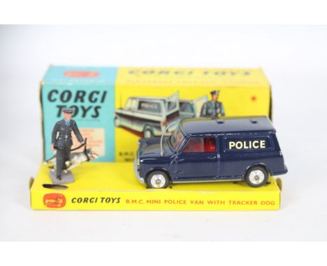 Corgi Toys - A boxed Corgi #448 BMC Police Mini Van (non pictorial issue). The van with blue body, red interior, spun hubs, w