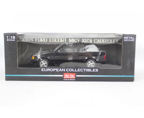 Sun Star - A rare boxed 1:18 scale 1984 Ford Escort XR3i Cabriolet in black # 4992R. The car appears Mint in a Good box with 