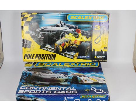 Scalextric - 2 boxed sets in 1:32 scale, # C1319 Continental Sports Cars, # C1097 Pole Position. Both sets show signs of use 