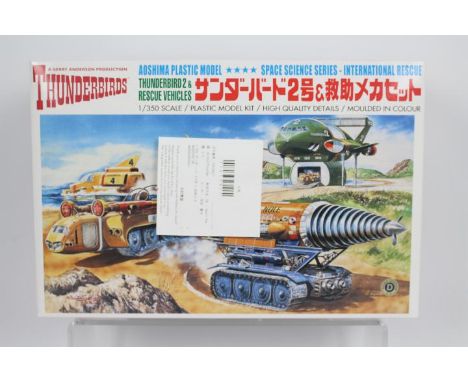Aoshima - A Gerry Anderson thunderbird 2 & rescue vehicle model kit. Item appears to be mint in a mint box with items in a cl