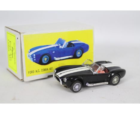 Palau, Scalextric - A boxed Limited Edition Ford AC Cobra 427 1:32 scale slot car by Palau the Spanish retailer. The model in