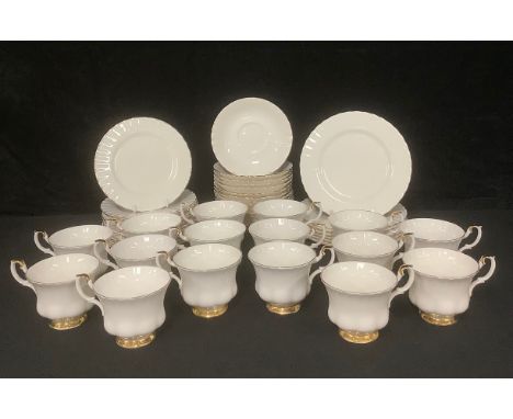 A Royal Albert Val D'Or pattern tea set, comprising fourteen cups and saucers, twelve tea plates, seven side plates, first qu