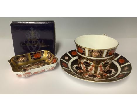 A Royal Crown Derby Imari 1128 pattern rectangular trinket tray, solid gold band, first quality, boxed; an 1128 pattern teacu