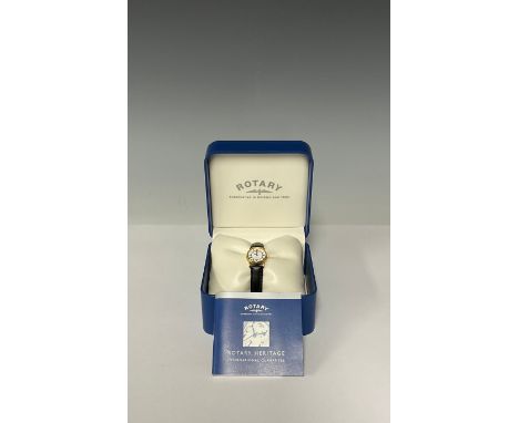 A lady's Rotary Elite 18k gold watch, white dial, Roman numerals, Black leather strap, boxed with purchase guarantee dated 20