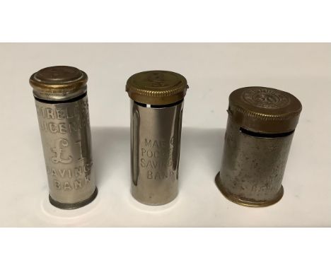 Boxes and Objects - Numismatics - a Wireless Licence £1 savings bank holding six pence coins; a Magic Pocket savings bank; a 