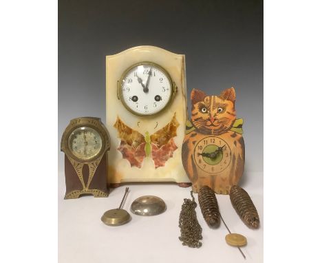 A French alabaster and onyx mantel clock, inlaid with a butterfly motif, pendulum and bell, 24.5cm; a novelty painted wooden 