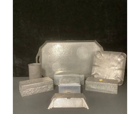 An Archibald Knox for Liberty Tudric mug, number 0334, 13.5cm; an Art Deco Gladwin pewter ink well, canted rectangular form, 
