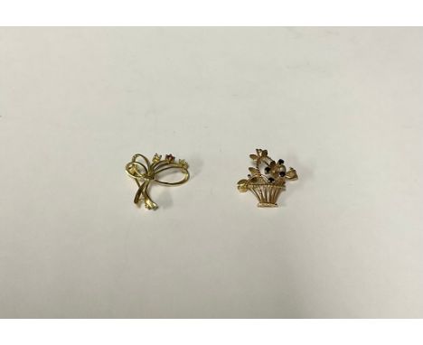 A 9ct gold brooch, in the form of a basket of flowers, accented with four faceted sapphire buds, 2.75cm, marked 375, London 1
