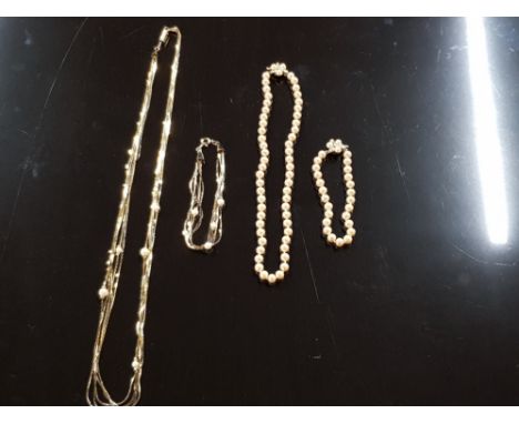 TWO SETS OF MATCHING PEARL NECKLACES AND BRACELETS