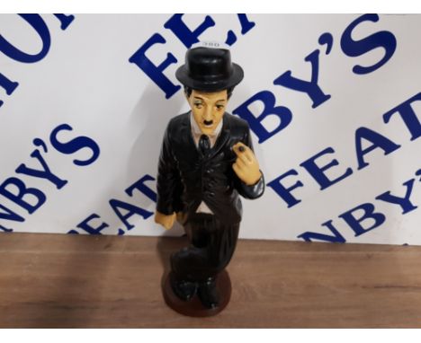 A CERAMIC CHARLIE CHAPLIN SCULPTURE 45CM HIGH