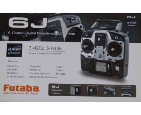 Futaba 6J-2.4GHZ transmitter and manual complete with seven receivers. Condition reports are not available for this sale.