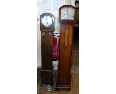 1930's Grandmother clock with three train movement, silver dial, oak case and one other similar clock. Condition reports are 
