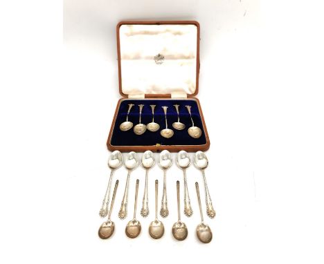 A leather cased set of six silver coffee spoons, six repousse silver teaspoons and five Art Deco chevron design small coffee 