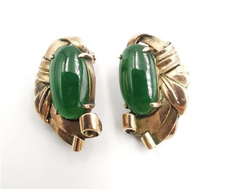 A pair of vintage yellow metal (test as 14 carat or higher) and Jade stylised foliate design clip earrings. The pair set with