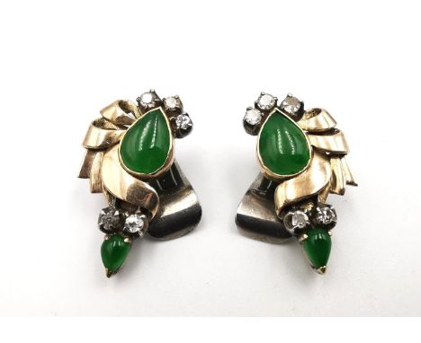 A pair of Chinese yellow and white metal (tests as 14 ct gold or higher and platinum) jade and diamond clip earrings. The two