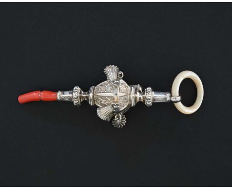 An Edwardian silver child's rattle, the faceted decorated body ensuite with six attached bells, with mother-of-pearl and cora
