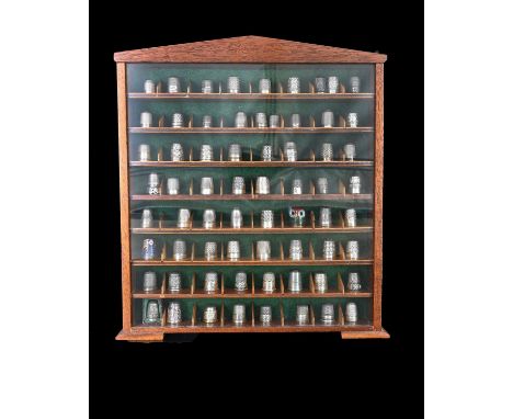 A collection of sixty-seven thimbles, early twentieth-century and later, to include thirty-five silver examples, eleven of wh