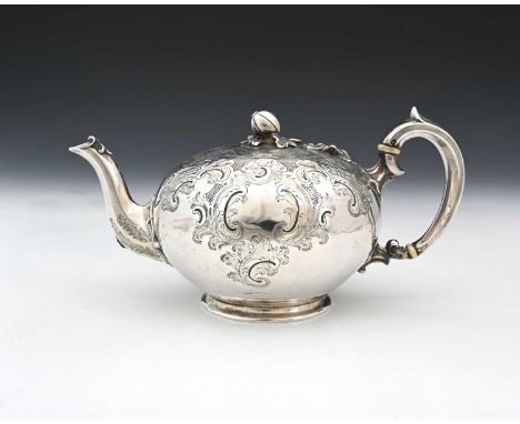A Victorian silver teapot, of globular form, the body decorated with trellis work, Rococo style scrolls, and foliage, with ap