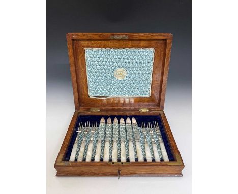 A cased Victorian dessert part-service, for six-place settings, comprising six knives and six three-pronged forks, each with 