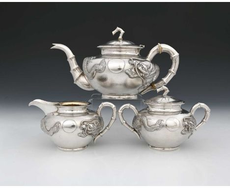 China.An early twentieth-century Chinese export silver three-piece tea set, comprising teapot, two-handle sugar bowl with cov