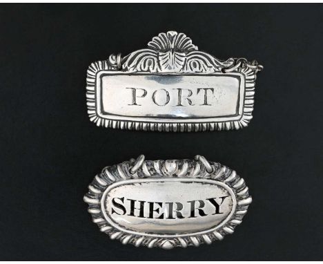 A George IV silver Regency cast wine label or bottle ticket, of rectangular form with gadrooned border, surmounted by scrolls