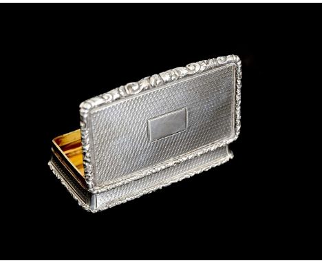 A Victorian silver snuff box, of rectangular form, with cast foliate scroll border, the body decorated with engine-turning an