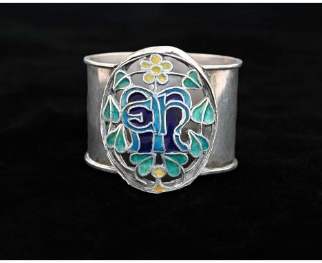 A George VI Arts &amp; Crafts style silver and champlevé enamel napkin ring, with a central pierced section depicting initial