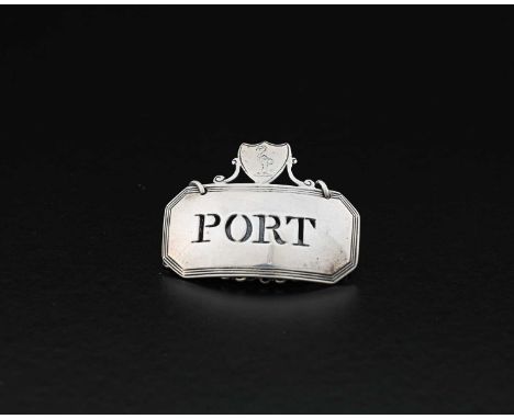 A George III silver wine label or bottle ticket, of rectangular form with canted corners and reeded border, surmounted by an 