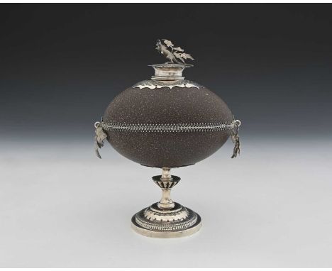 Australia.A nineteenth-century Australian emu egg inkwell, mounted in silver-coloured metal, of ovoid and circular form, with