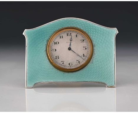 A George V silver and enamel Art Deco style timepiece, of shaped rectangular form, decorated with guilloche enamel in soft bl