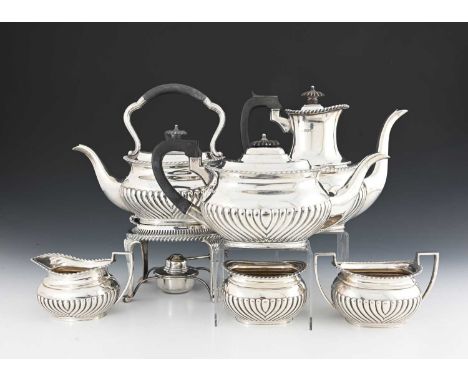 A George V silver six-piece tea and coffee service, comprising kettle on stand, teapot, coffee pot, cream jug, sugar bowl, an
