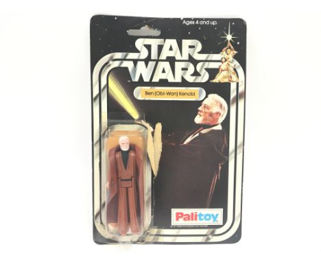A Vintage Star Wars Palitoy 1977 Carded Ben Obi-Wan Kenobi. One of the first 12 Figures released. Damage to Card And Blister.
