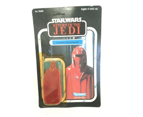 A Vintage Star Wars Return of The Jedi Emperors Royal Guard carded and Unpunched. yellowing to Blister and hole at Top