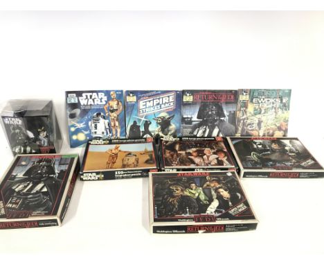 Collection of vintage Star Wars puzzles and read along book and record.