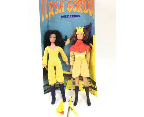 A Vintage Mego Corp Flash Gordon Dale Arden figure with backing Card and a Vintage Charlieâ€™s Angels Figure.