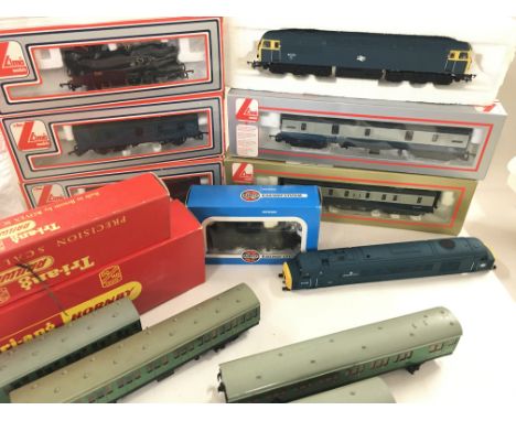A Collection of Boxed Lima 00 gauge Coaches. And 4 Locomotives.