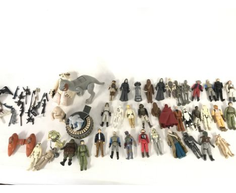 A Box Containing a Collection Of Vintage Star Wars Figures and some Guns.